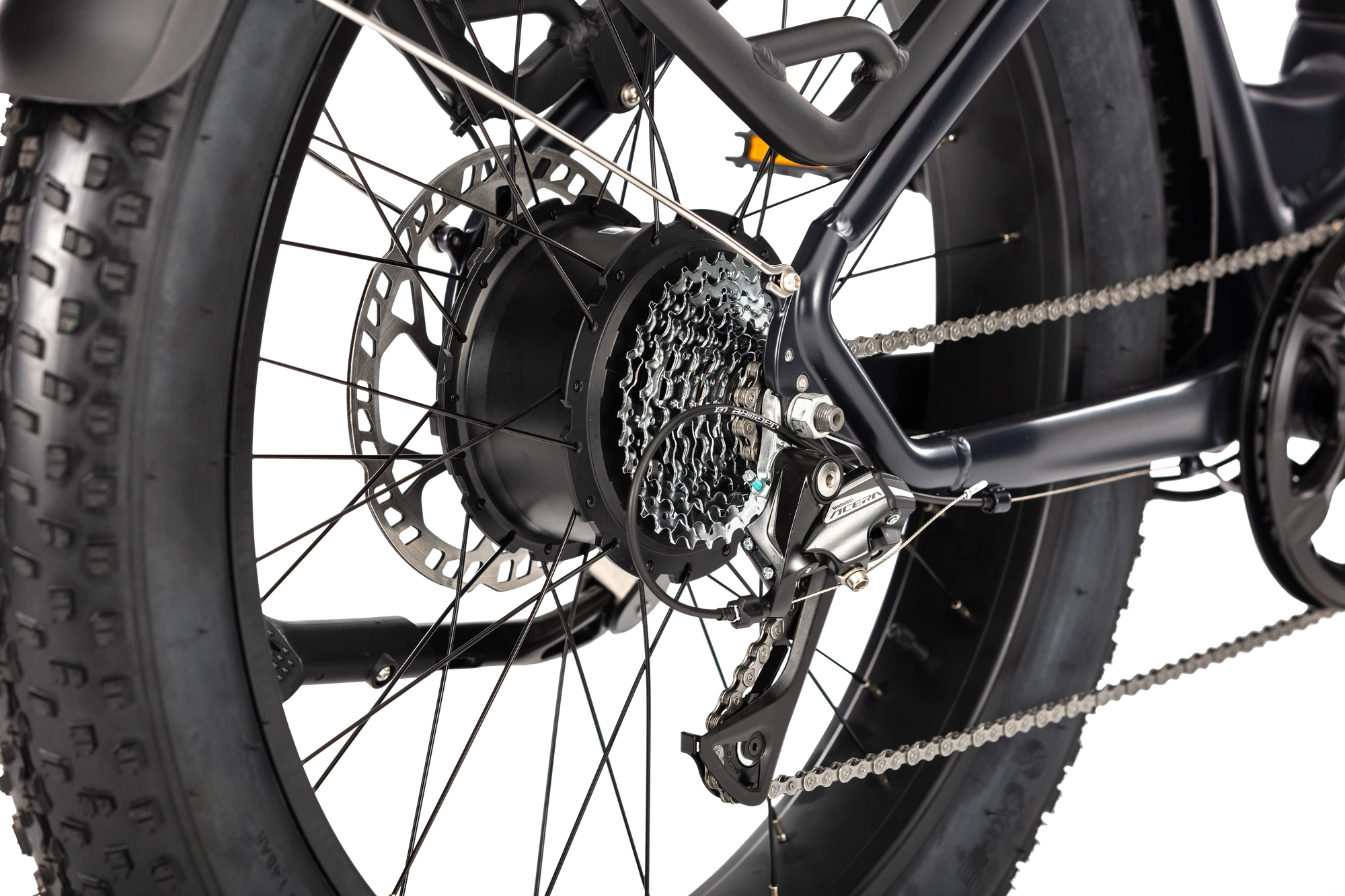 Close-up of the E11EVEN DEFIANT electric bike rear wheel, showing the hub motor, cassette, chain, derailleur, and disc brake rotor