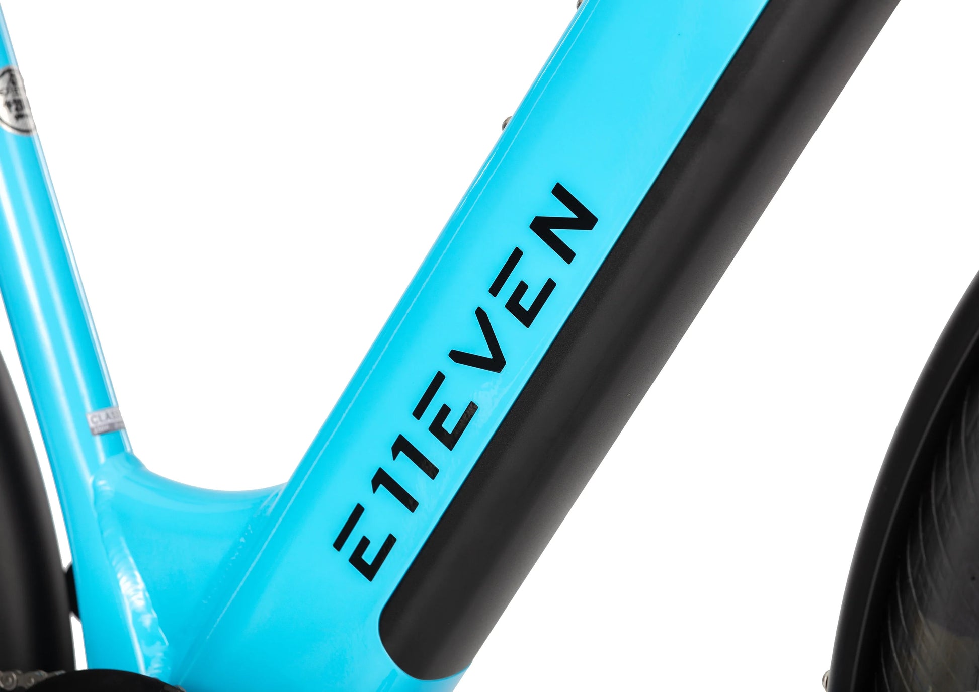 E11EVEN Dragonfly light blue electric commuter bike branded frame close‑up, step‑through ebike downtube