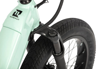 Close-up of the front fork head tube on the E11EVEN WINGMAN electric bike.
