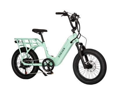 E11EVEN Wingman mint green compact ebike angled side view with rear rack and tall handlebar